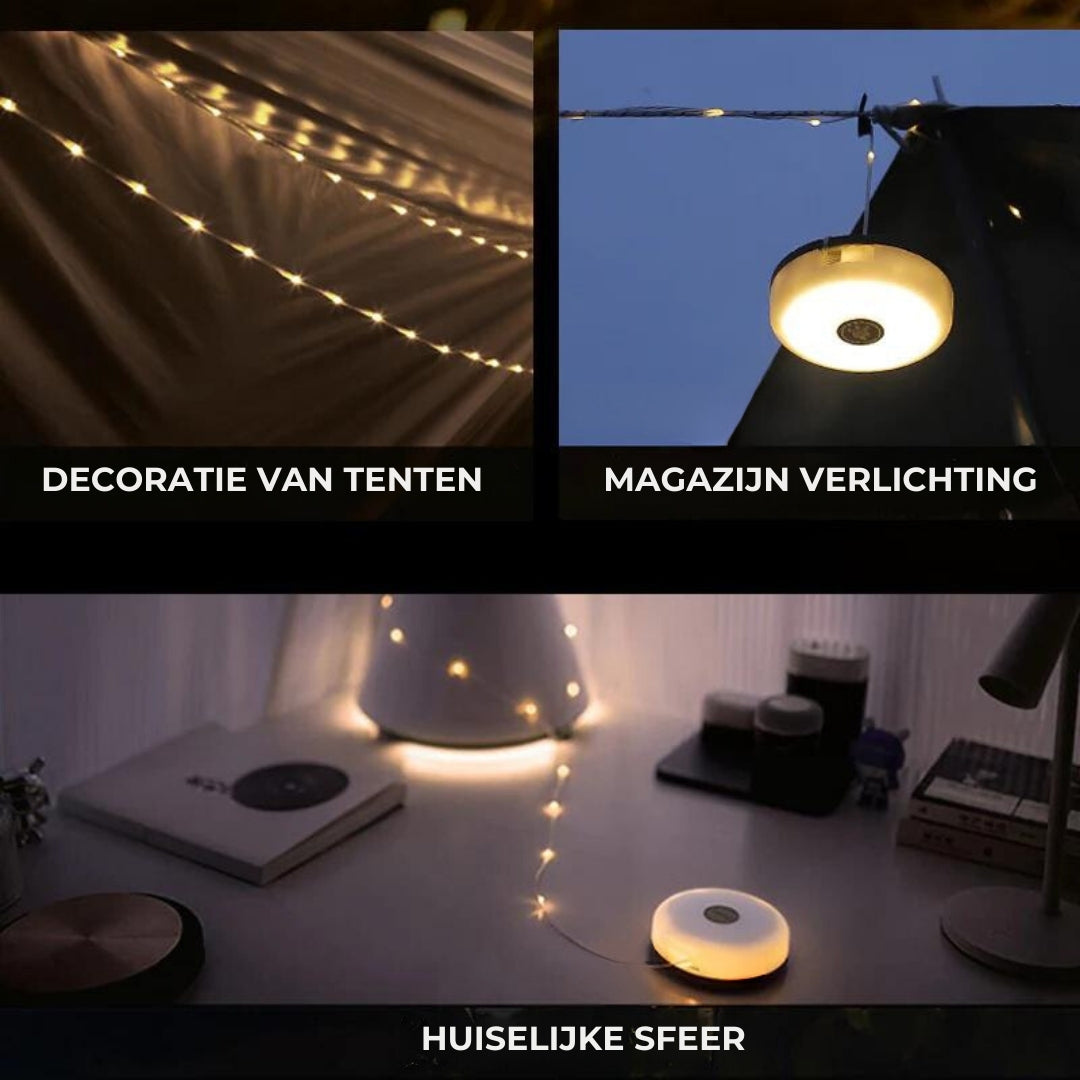 Oprolbare waterdichte buitenverlichting en campinglamp op een houten tafel