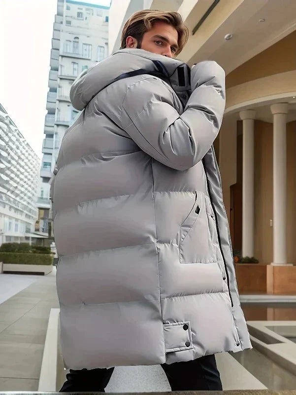 Heren lange dikke winterjas Nelson in de kleur grijs van voren gezien