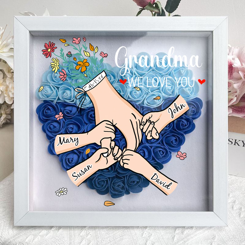 Artistieke schaduwdoos met bloemmotieven en aanpasbare namen, een hartverwarmend geschenk.