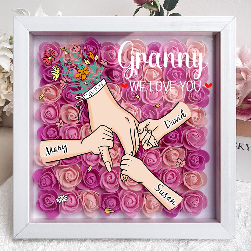 Gepersonaliseerd Moederdag of verjaardag cadeau: schaduwdoos met bloemen en familielidnamen.