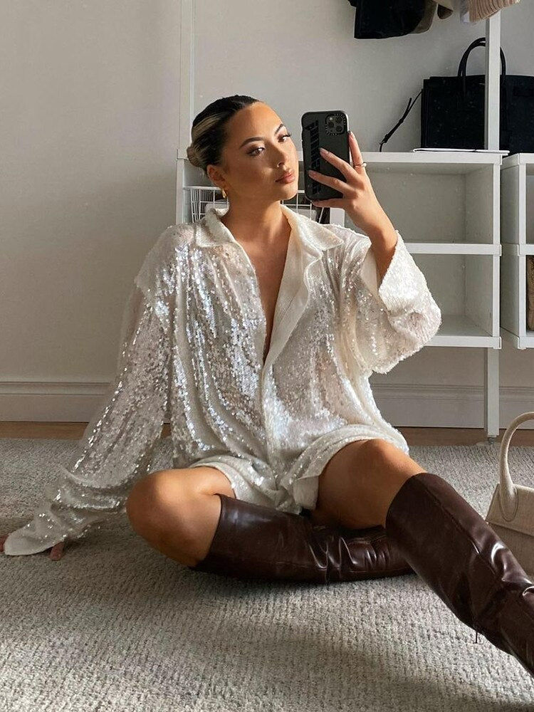 Sprankelende oversized glitterblouse voor dames; een feestelijke en comfortabele toevoeging aan je garderobe.