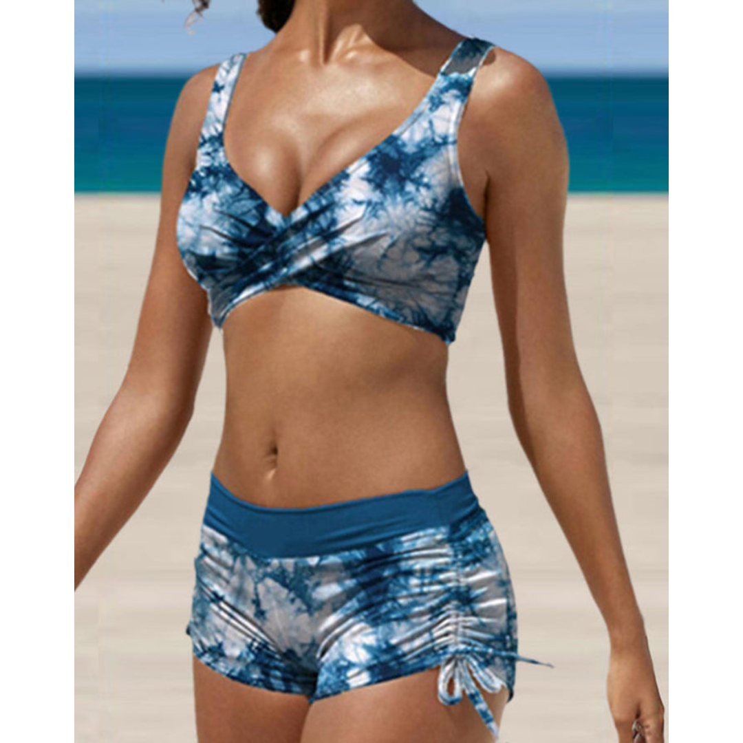 Blauwe camouflage print dames bikini, corrigerend en sneldrogend, voor een trendy en comfortabele look.