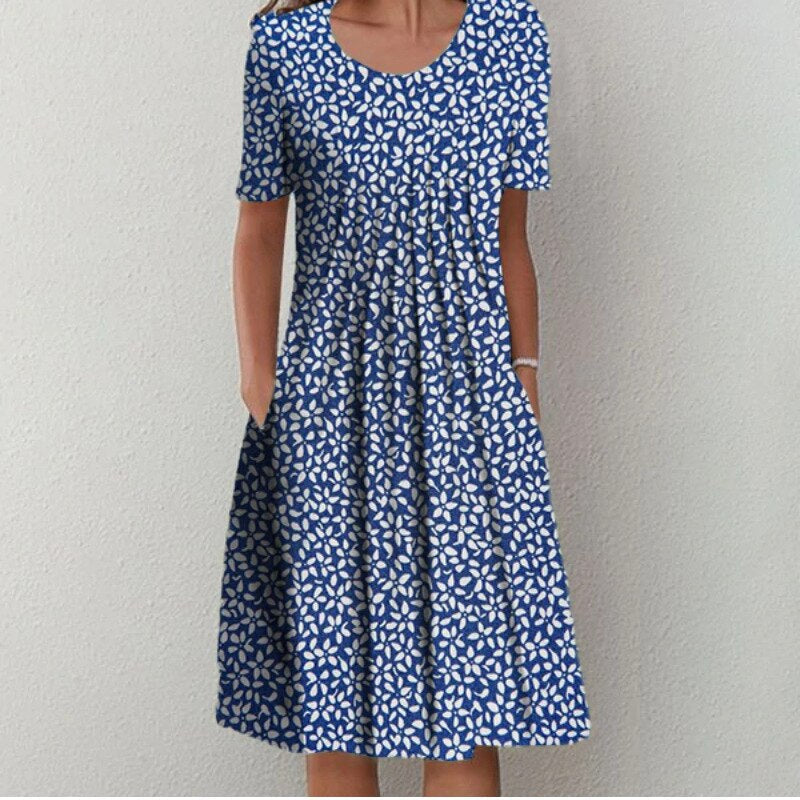 Comfortabele en elegante dames zomerjurk met levendige bloemenprint en v-hals. Luchtige midi-jurk voor elke gelegenheid.