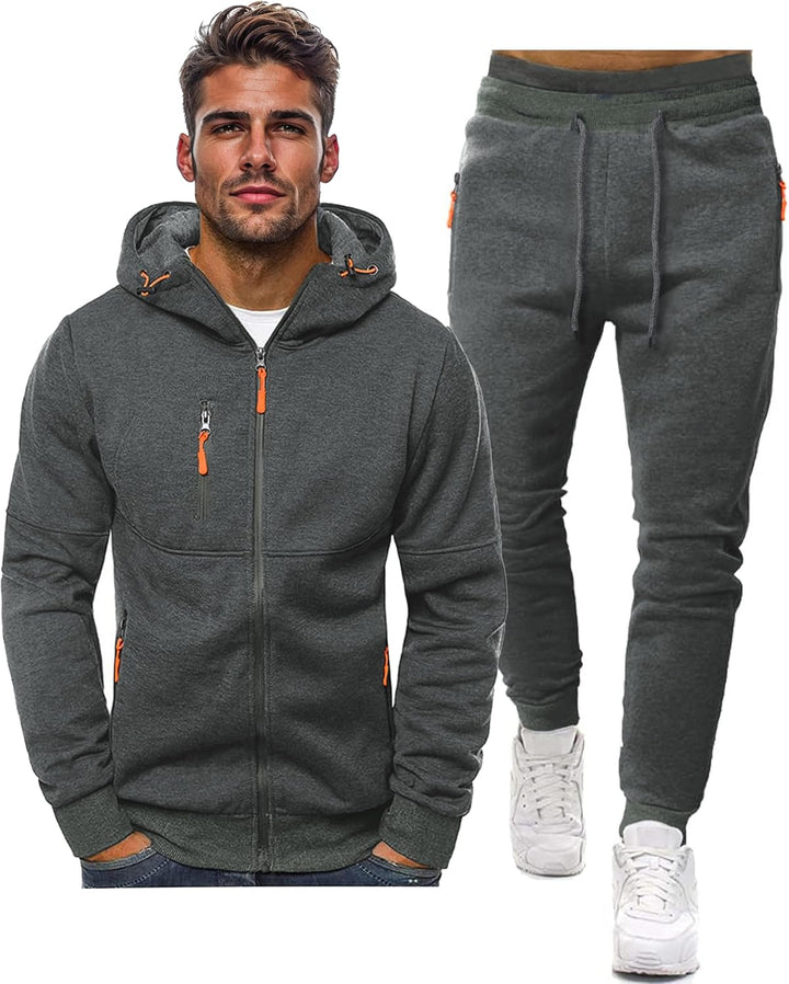 Model toont stijlvol heren trainingspak tijdens fitness. Comfortabele sportkleding voor mannen.