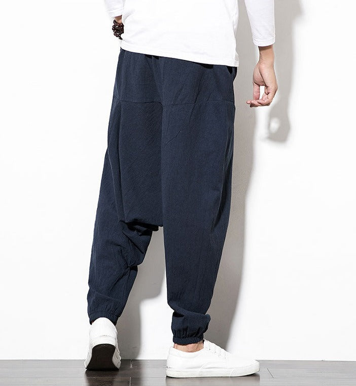 Heren sportkleding: zwarte harem joggingbroek, flexibel en modieus.