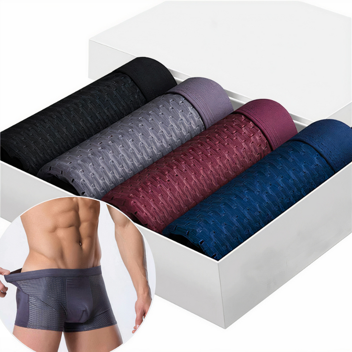 Set van 4 heren boxershorts in zwart, grijs, rood en blauw, met een model die een comfortabele boxer draagt.