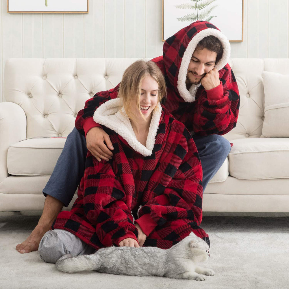 Zachte, oversized hoodie deken, perfect voor ontspanning op koude winteravonden.