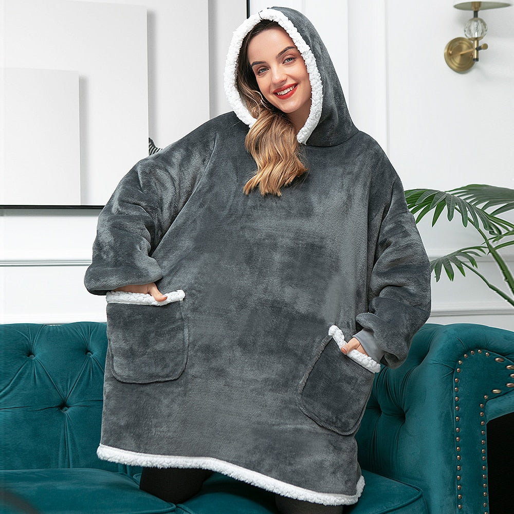 Knusse avonden gegarandeerd met deze warme hoodie deken. Perfect voor relaxen.