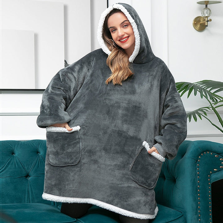 Knusse avonden gegarandeerd met deze warme hoodie deken. Perfect voor relaxen.