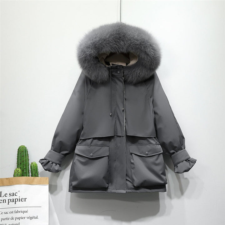 Warme buitenkleding dames, elegante thermojas, ideaal voor de winterse elegantie.