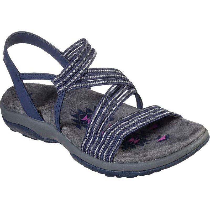Dames comfort sandalen Sandls™ aan de voet, met flexibele banden voor een perfecte, pijnvrije pasvorm.