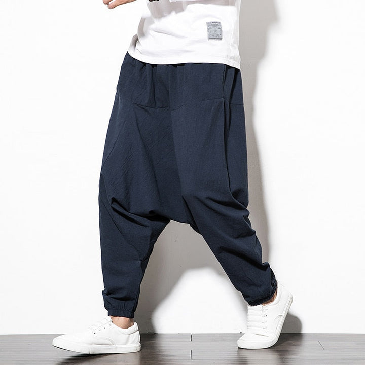 Zwarte heren harem trainingsbroek, veelzijdig voor zowel sport als casual kleding.