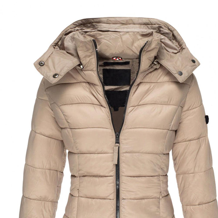 Grijze dames jas met capuchon, comfortabel en beschermend tegen wind en regen, stijlvolle oversized pasvorm.