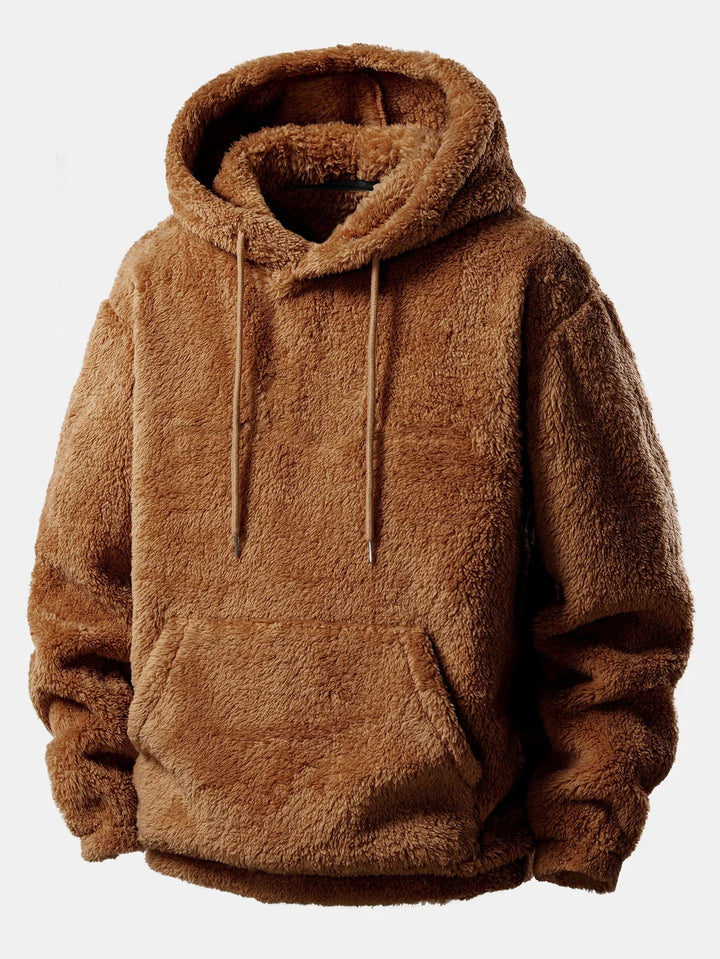 Detailopname van de zachte pluche stof van de unisex loungeset