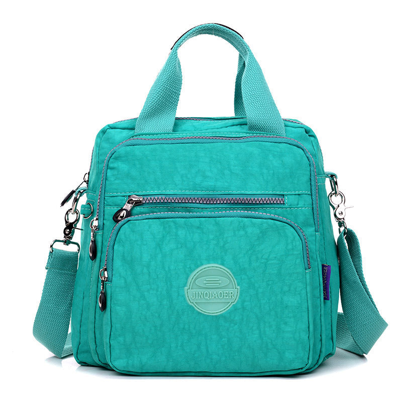 Waterdichte crossbody tas met meerdere vakken, dames model voor optimale organisatie en comfort.