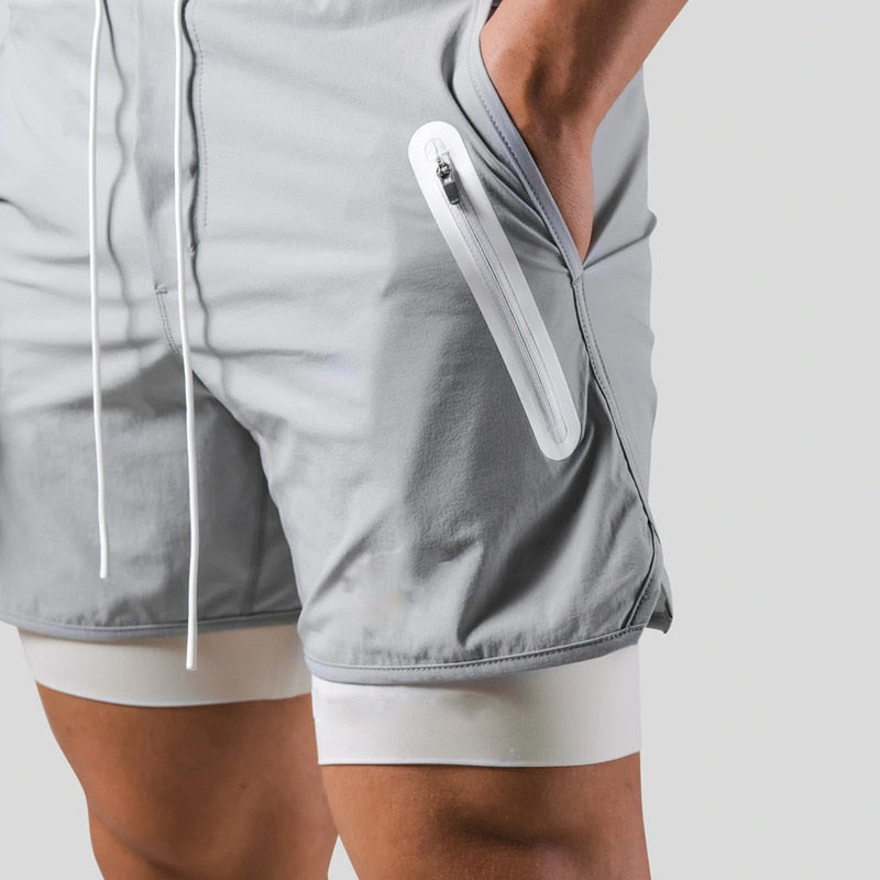Heren 2-in-1 sportbroek met geïntegreerde compressie short. Ideaal voor training en gym, met stretch.