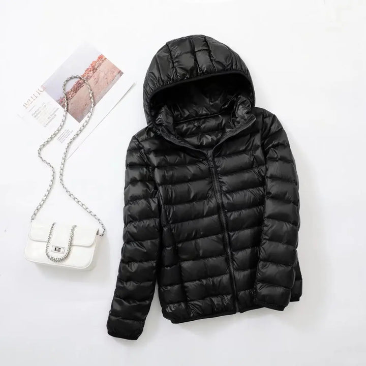 Stijlvolle Hoymans donsjas dames, met capuchon, pufferjack, als warme winterjas.