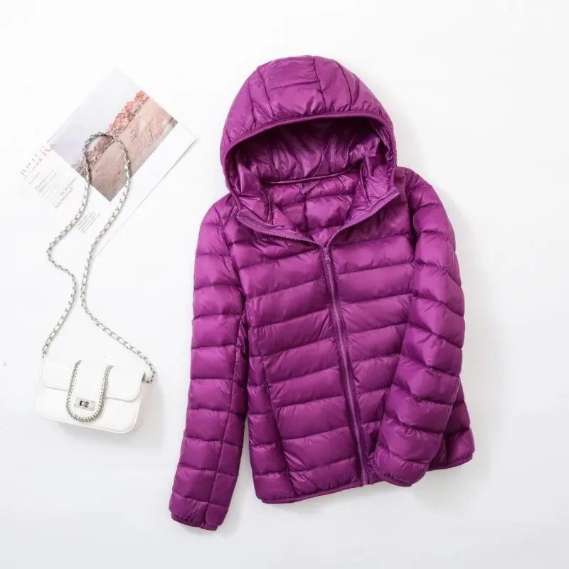 Trendy Hoymans pufferjack dames, donsjas met capuchon, ideaal voor buitenactiviteiten.