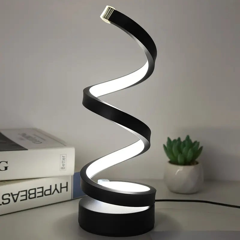 Elegante zwarte spiraal LED tafellamp met modern design. Ideaal voor sfeerverlichting in elk interieur, dimbaar voor ambiance.