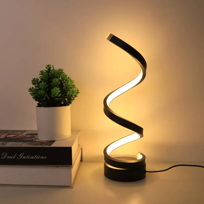 Moderne spiraal LED tafellamp, zwart en dimbaar. Stijlvolle design lamp voor sfeervolle verlichting in woonkamer of slaapkamer.