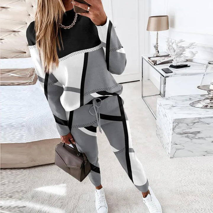 Veelzijdige damesmode set met comfortabele O-hals trui en lange broek, perfect voor ontspanning en stijl.