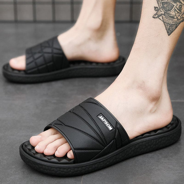 Zwarte orthopedische herenslippers, essentieel voor voetgezondheid, comfort en dagelijks gebruik.
