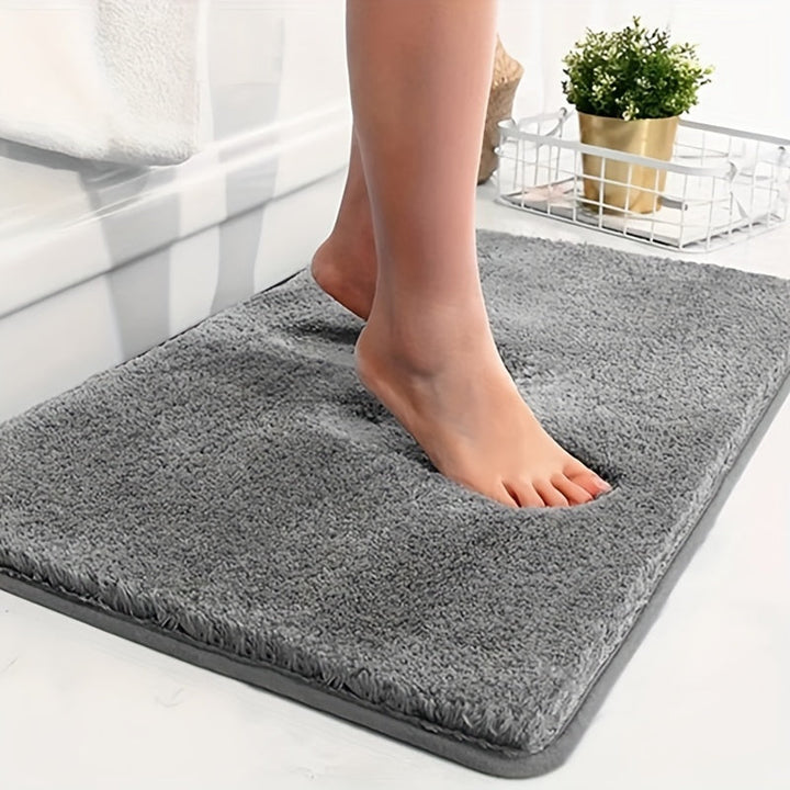 "Absorberende antislip badmat met geometrisch patroon, zacht gevoerd, ideaal voor moderne badkamer."