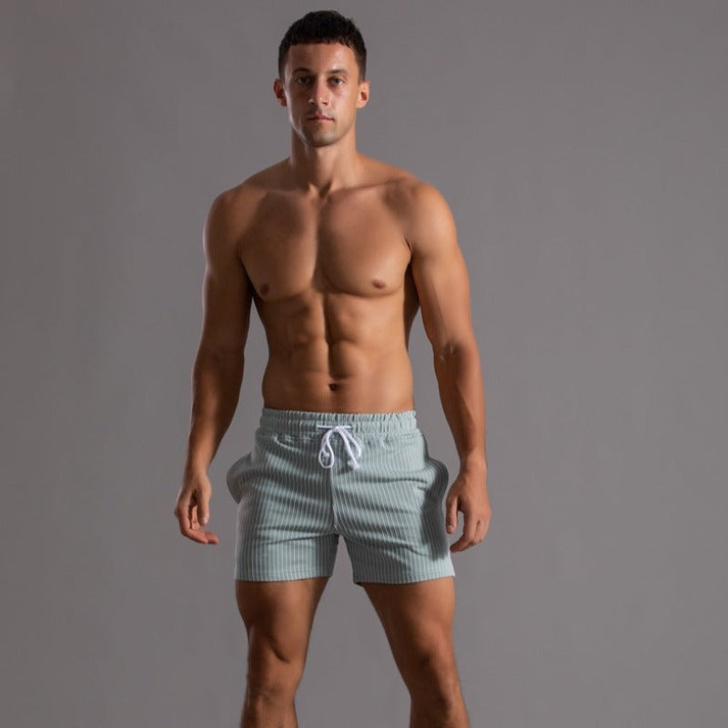 Achterkant van de zwarte Arno stretch broek en fitness shorts voor heren