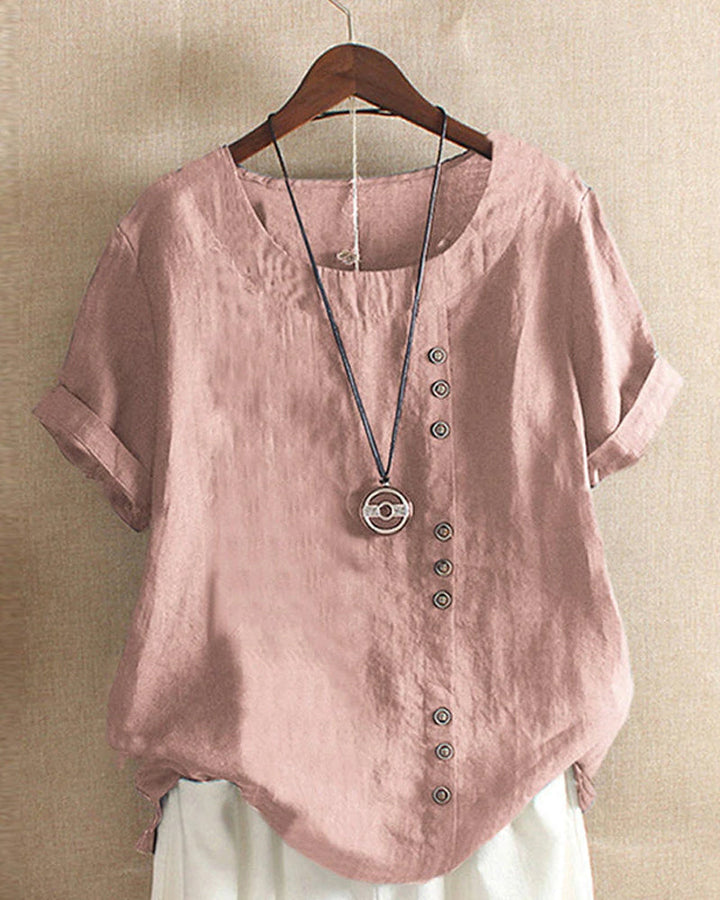 "Asymmetrische linnen blouse met moderne knopen, lichtgroen, ideaal voor casual en chique gelegenheden, stijlvolle look."