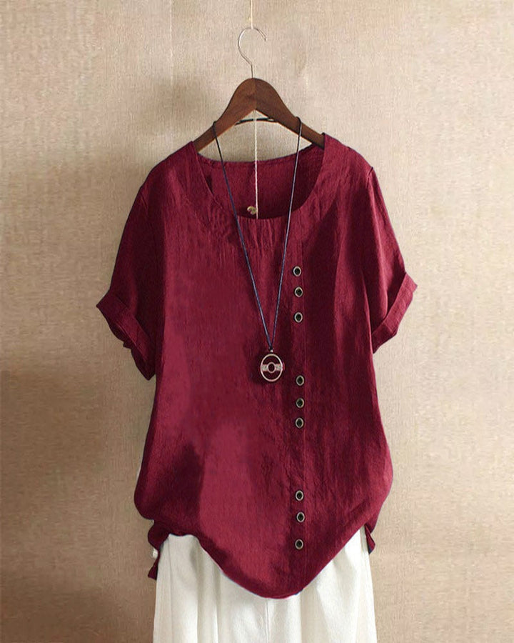"Asymmetrische linnen blouse met moderne knopen, lichtgroen, ideaal voor casual en chique gelegenheden, stijlvolle look."