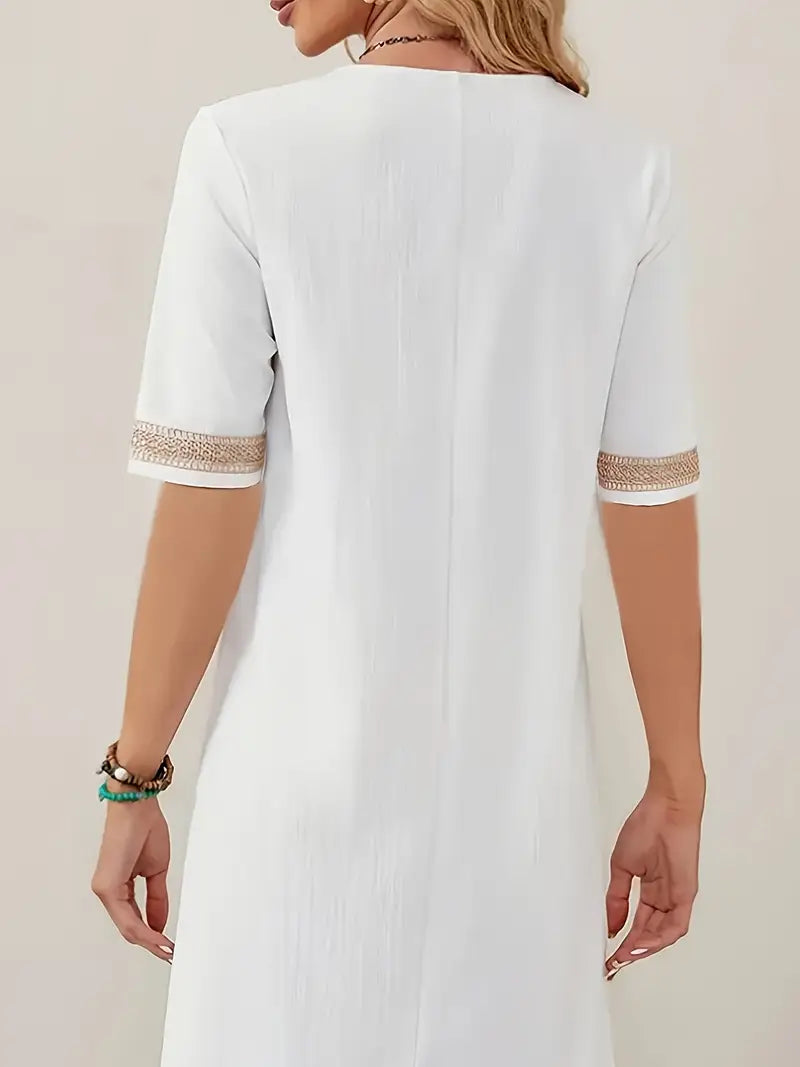 Stijlvolle, losvallende linnen dames midi jurk, perfect voor een casual zomer of elegante vakantieoutfit.
