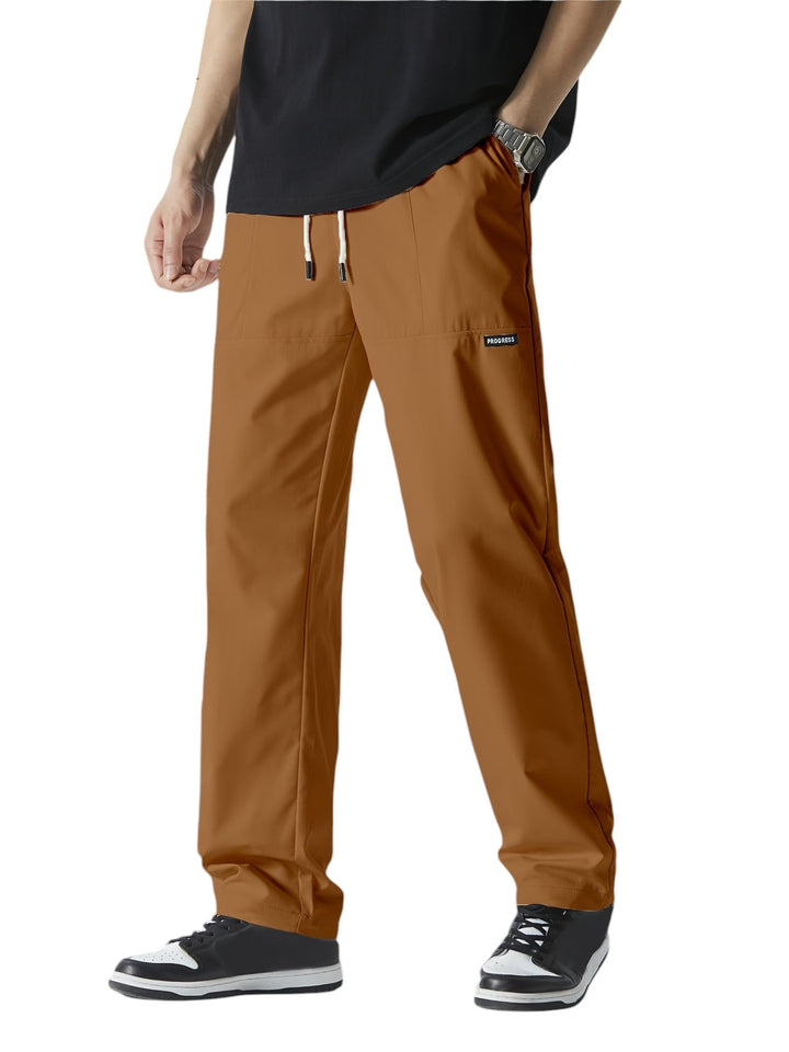 "Casual chique heren joggingbroek, donkergrijs, ademende stof, elastische tailleband met trekkoord, comfortabele pasvorm."