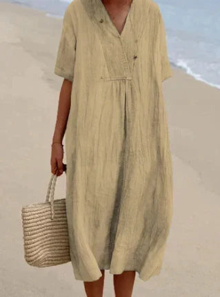 Modieuze casual midi zomerjurk voor dames. Trendy ontwerp met ronde hals en korte mouwen, erg stijlvol.
