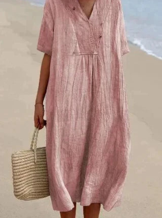 Kleurrijke casual midi jurk voor dames. Vrolijke zomerjurk met korte mouwen, veelzijdig en comfortabel.