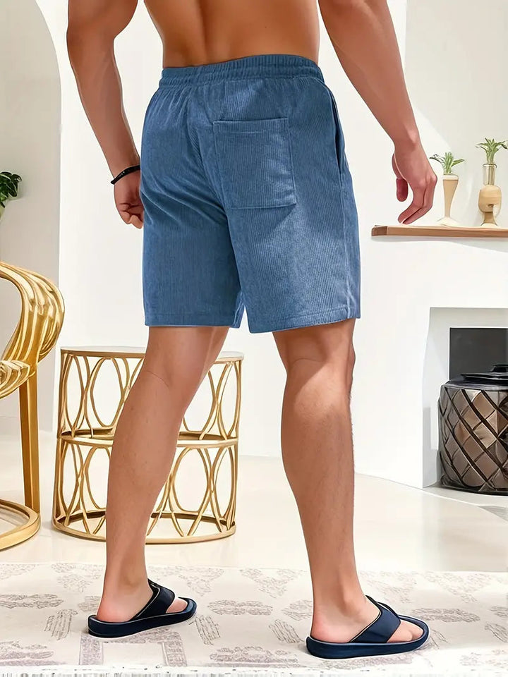 Relaxte heren strandbroek met elastische taille en trekkoord, ideaal voor een comfortabele dag aan zee.