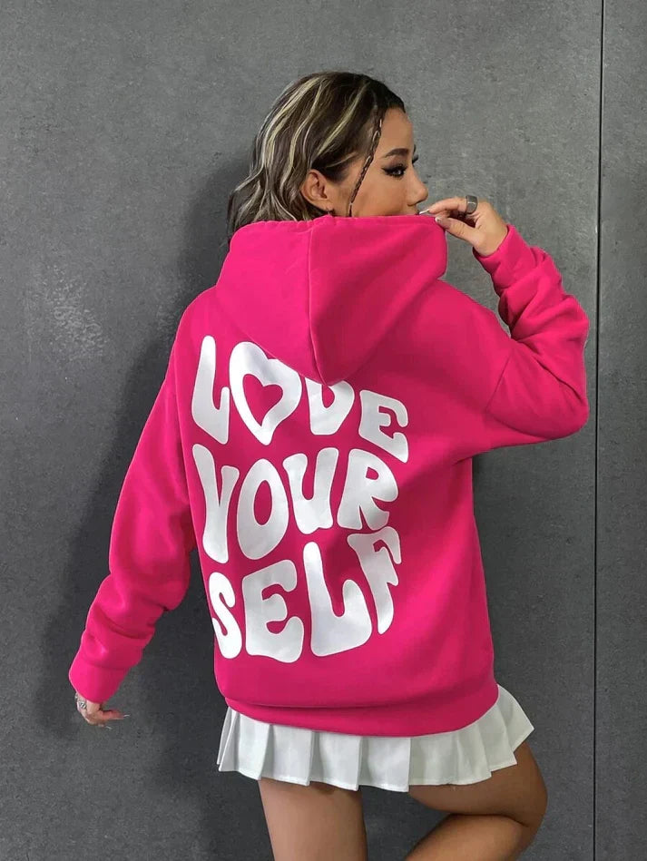 Comfortabele hoodie met "Hou van jezelf" spreuk in zachte katoenen stof, verkrijgbaar in diverse kleuren voor dames.