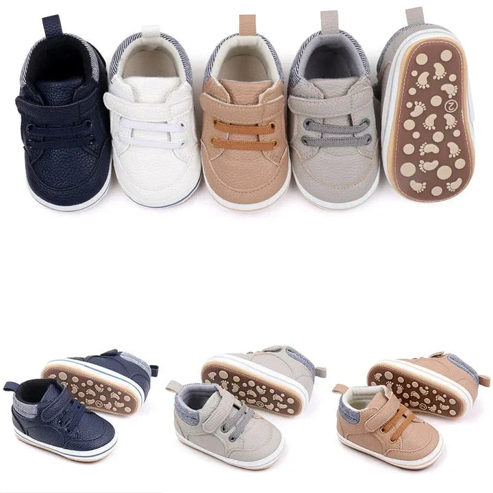 "Comfortabele leren baby schoenen, zacht en stijlvol in blauw, bruin, grijs of wit met antislipzolen voor eerste stapjes."