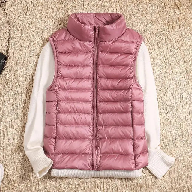 Dames bodywarmer met een verfijnde look: hoge kraag, slank silhouet. Perfect voor modebewuste vrouwen.