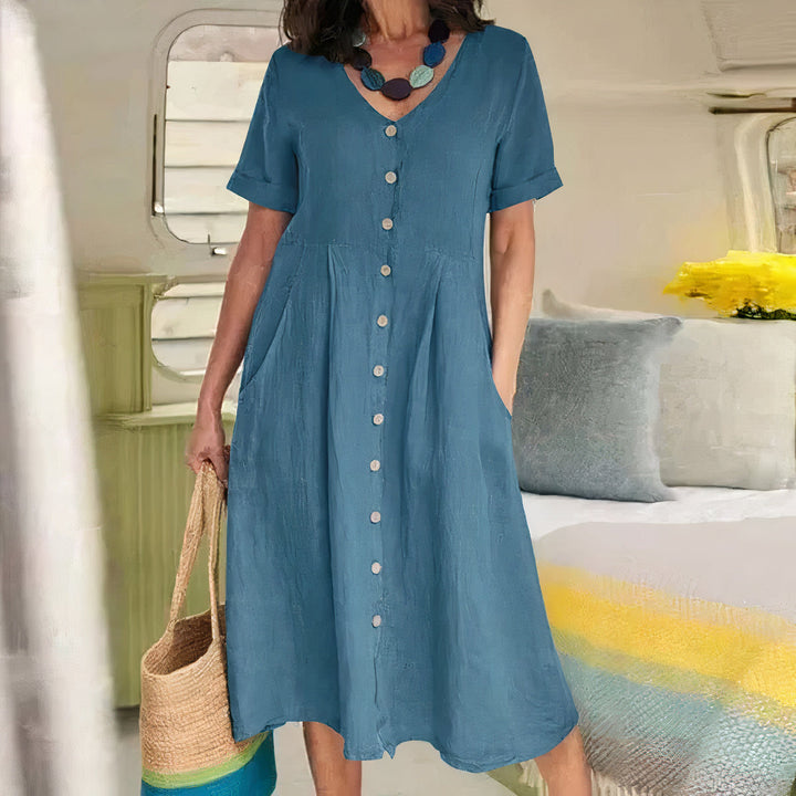 Zachte casual dames midi jurk met V-hals en knoopdetail, comfortabel voor de zomer.