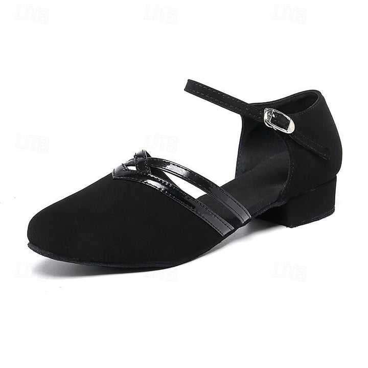 "Dames dansschoenen, comfortabel, flexibel voor moderne dans, elegante lage hak, ronde teen, zwarte afwerking."