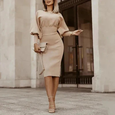Lente/zomer midi jurk in beige met lantaarnmouwen. Comfortabele en elegante dames kantoorjurk.