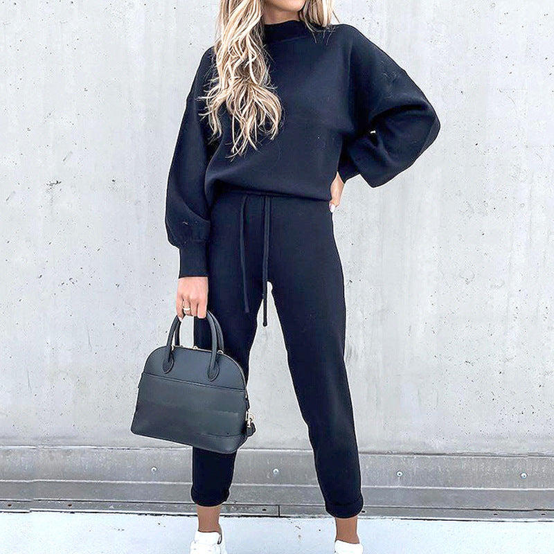 Dames winter huispak met modieuze rollkraag en flatterende hoge taille broek voor dagelijks comfort.