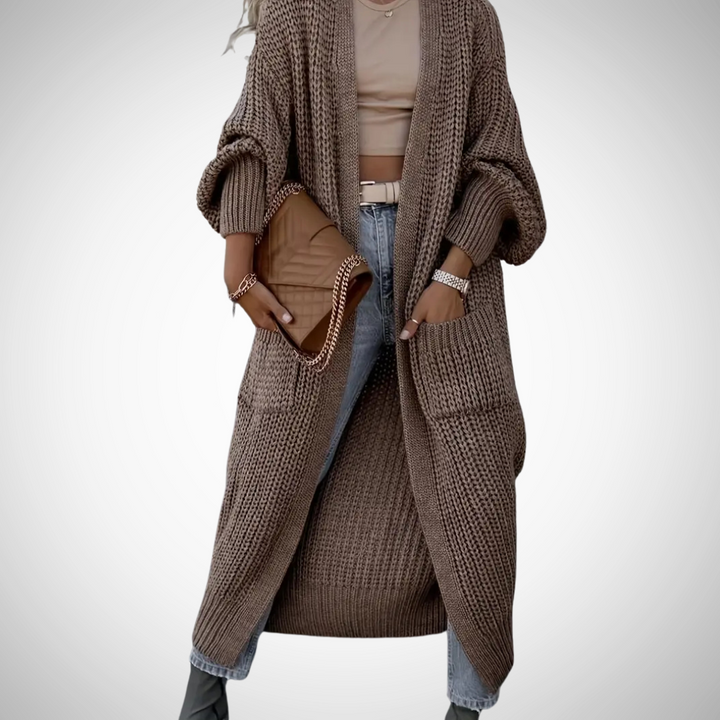 Dames lang open cardigan vest met zakken, ideaal voor laagjes in herfst/winter. Comfortabel en stijlvol.