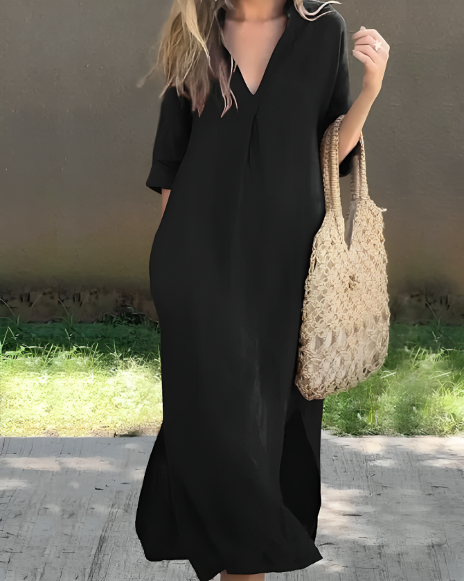 Veelzijdige dames maxi jurk, ideaal voor zomer. Met V-hals, driekwart mouwen en handige zijzakken.