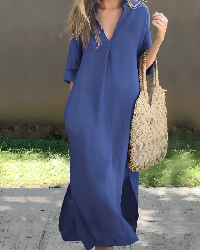 Elegante dames maxi jurk met V-hals, driekwart mouwen en handige zijzakken. Perfecte zomerjurk.