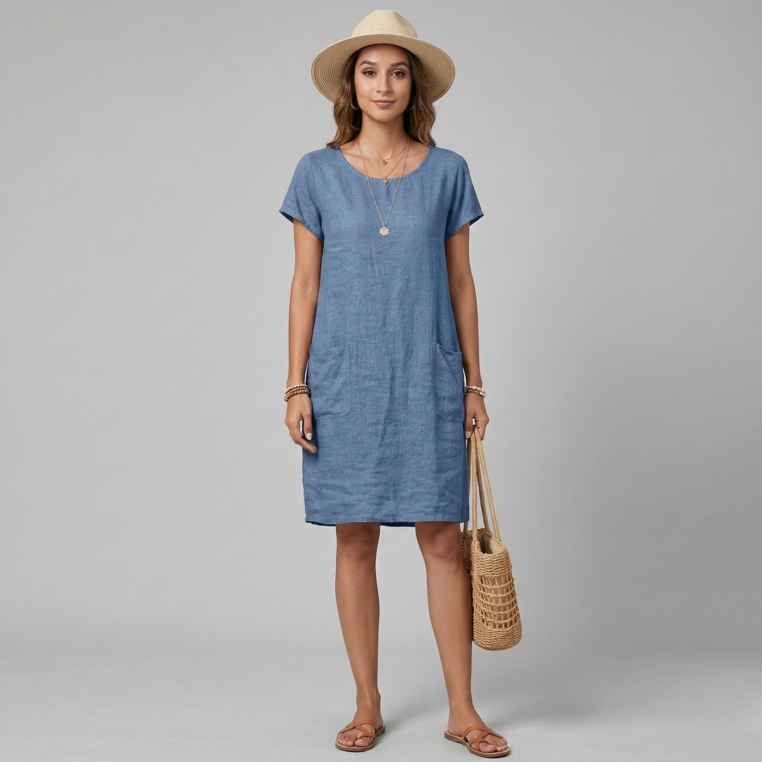 Dames jurk met korte mouw, comfortabele ronde hals en ruime zakken, ideaal voor casual dagen.