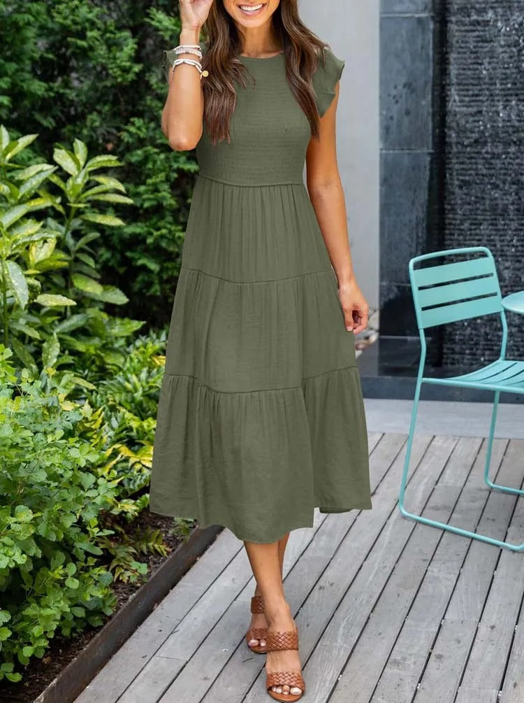 Elegante dames zomerjurk, midi lengte, met unieke vlindermouwen, geschikt voor feesten.