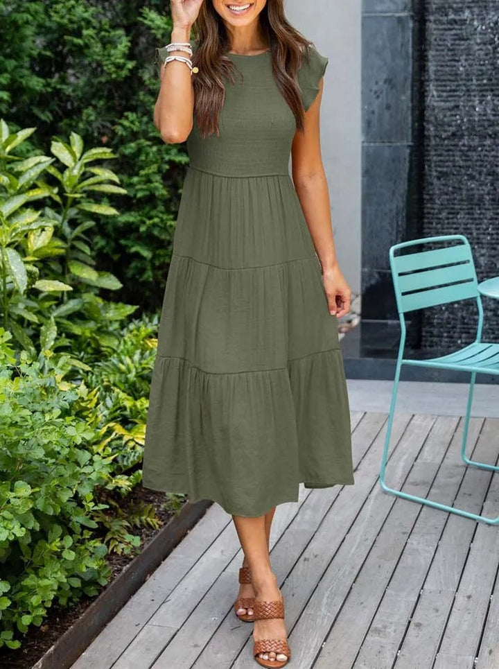 Elegante dames zomerjurk, midi lengte, met unieke vlindermouwen, geschikt voor feesten.