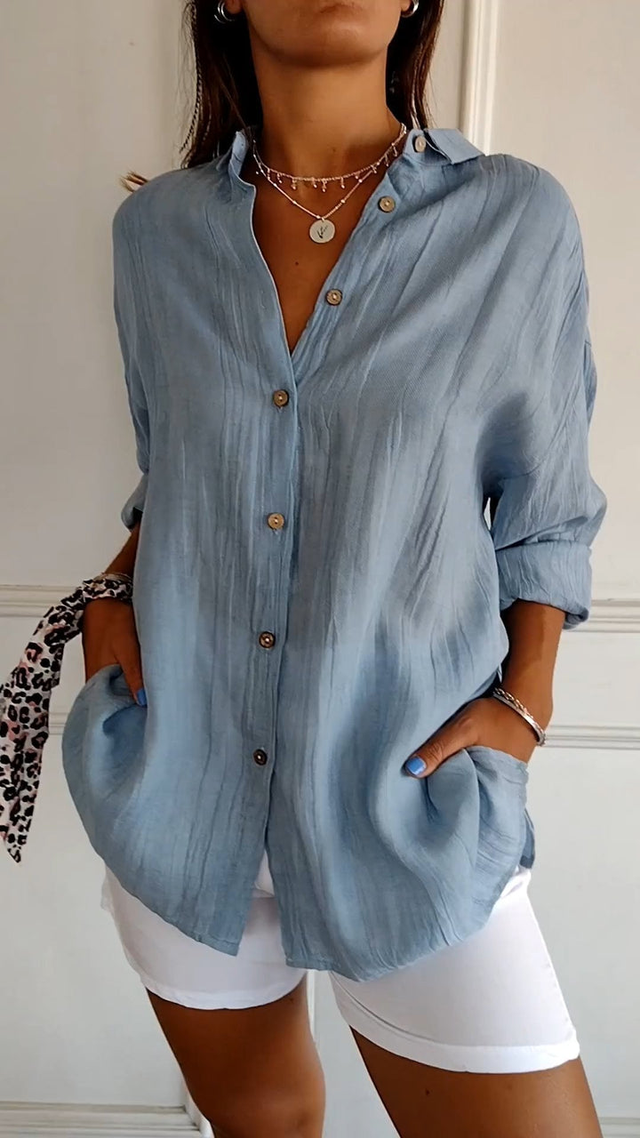 Casual dames blouse, losvallend, met lange mouwen en praktische zijzakken.