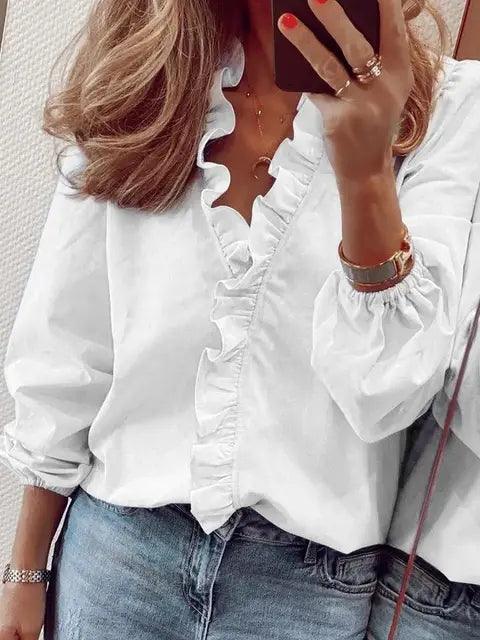 Elegante damesblouse met lange mouwen en V-hals, verfraaid met ruches. Geschikt voor zowel kantoor als casual chic.